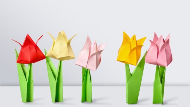 Origami flowers on white background