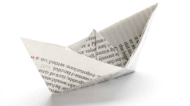 Paper ship on white background.